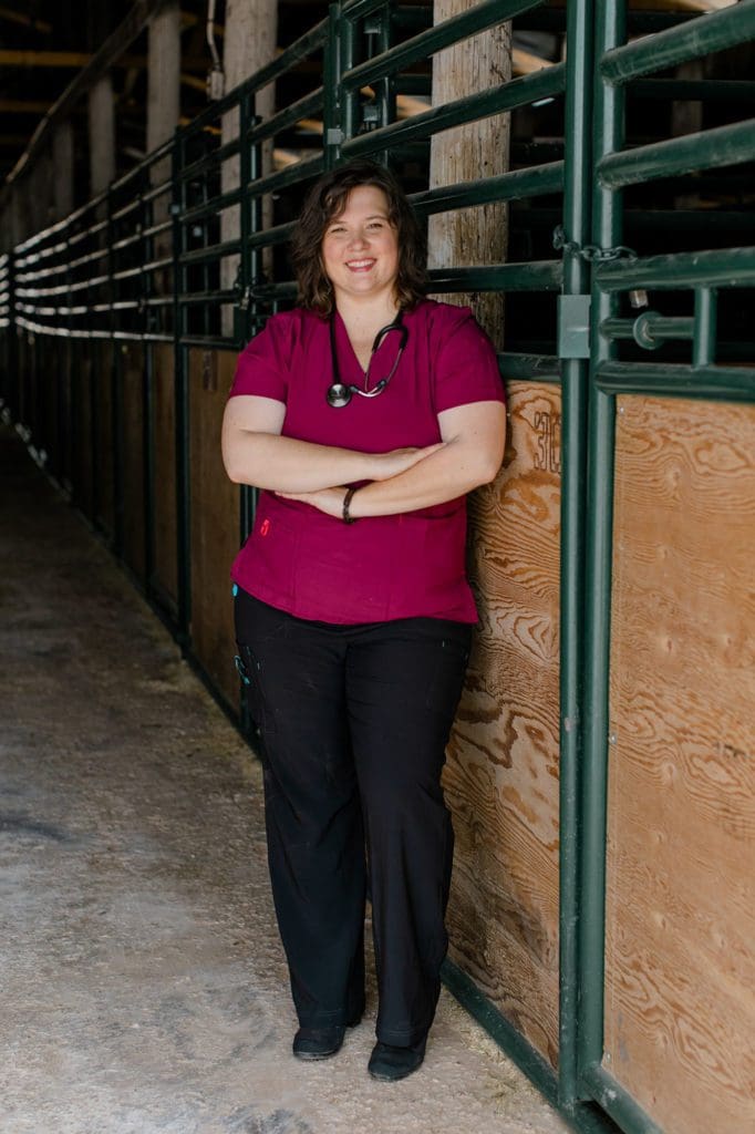 Dr. Chelsea Burke standing in a barn